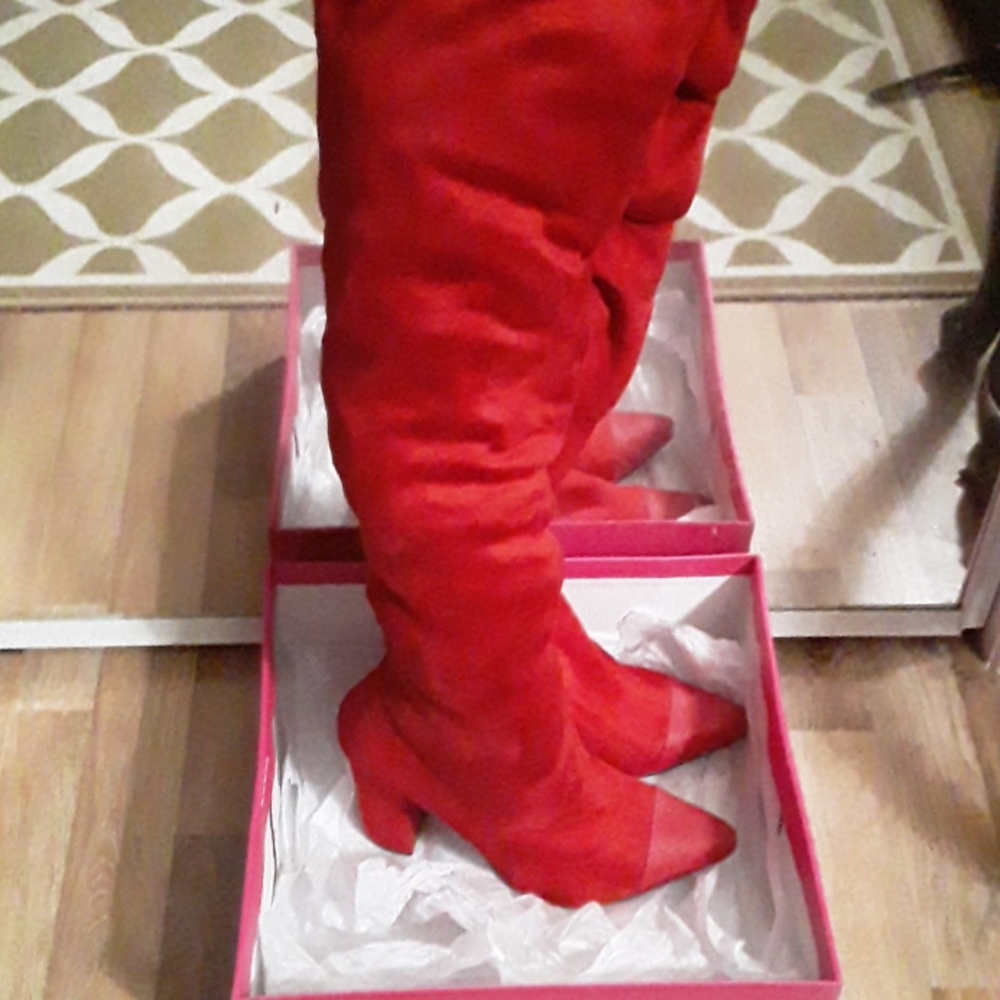 High knee heeled boots
